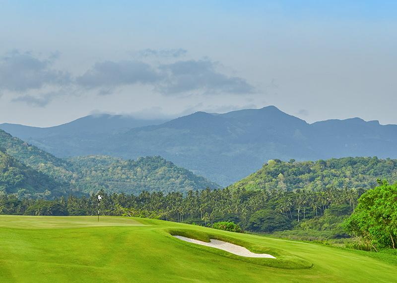 Victoria Golf Resort fairway view with mountains in the background