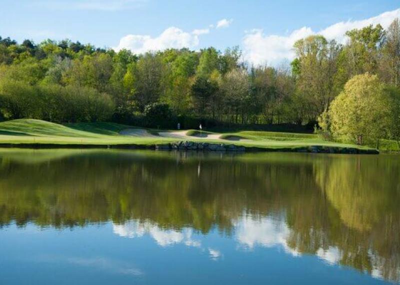 Bogogno golf water hazard and green in the background