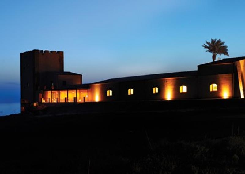 verdura resort by night with lit up building